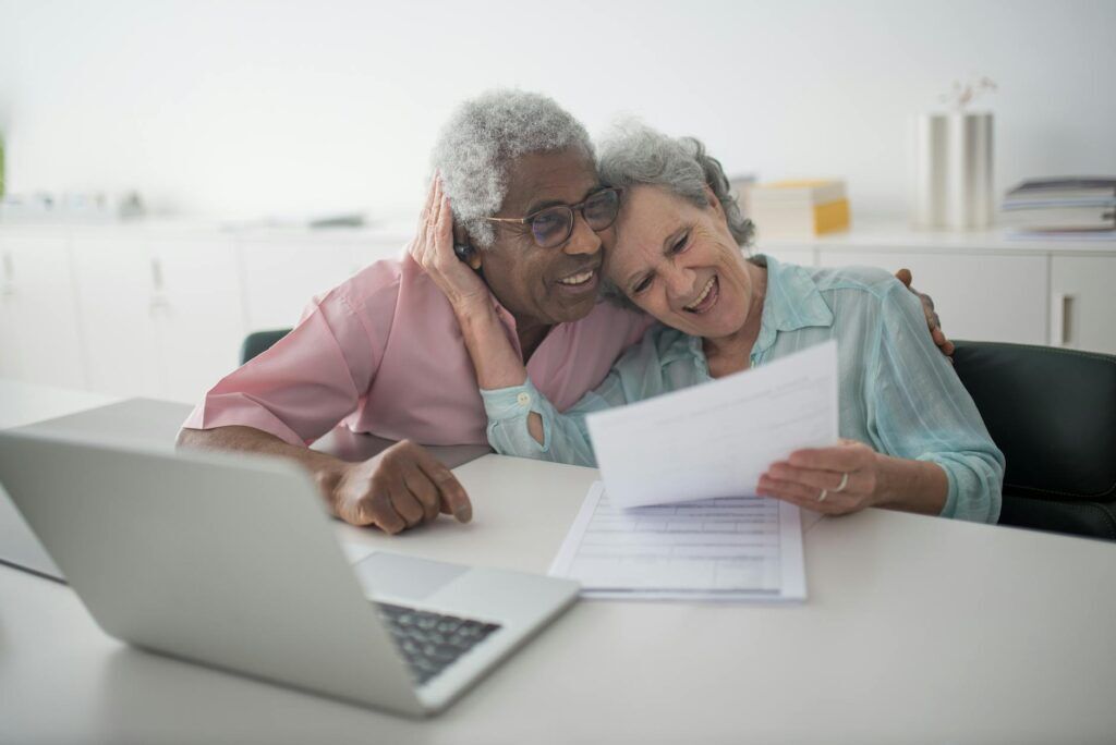 California senior reviewing Medicare Advantage plan options with caregiver support